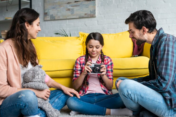 daughter-looking-camera-parents_23-2148456321